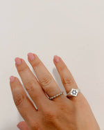Hand wearing a silver Star of David ring