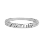 Silver engraved ring on white background