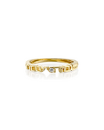 Gold ring with diamond on white background