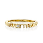 Gold ring with diamond on white background