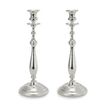Two silver candlesticks on white background