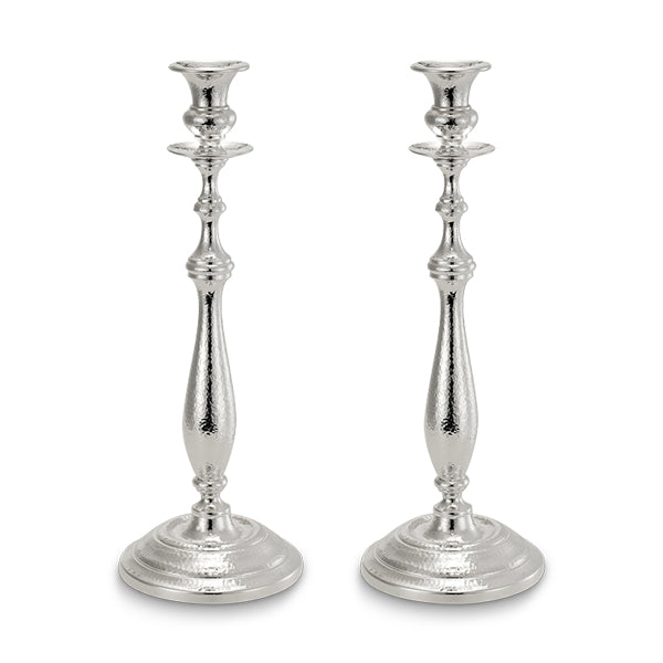 Two silver candlesticks on white background