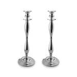Two silver candlesticks on white background