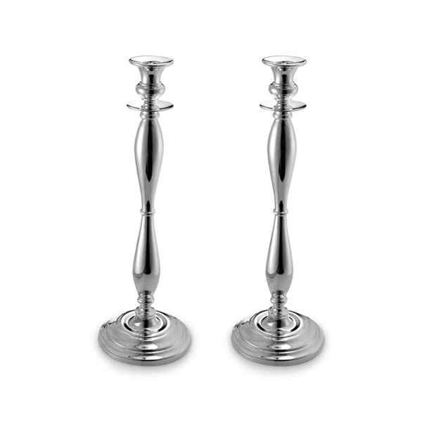 Two silver candlesticks on white background