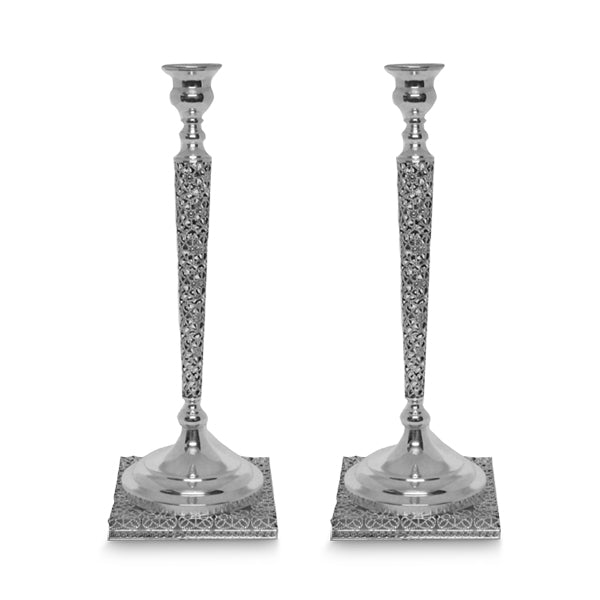 Two silver candle holders on white background