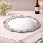 Silver platter on table with wine bottle