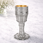 Ornate silver goblet with gold interior