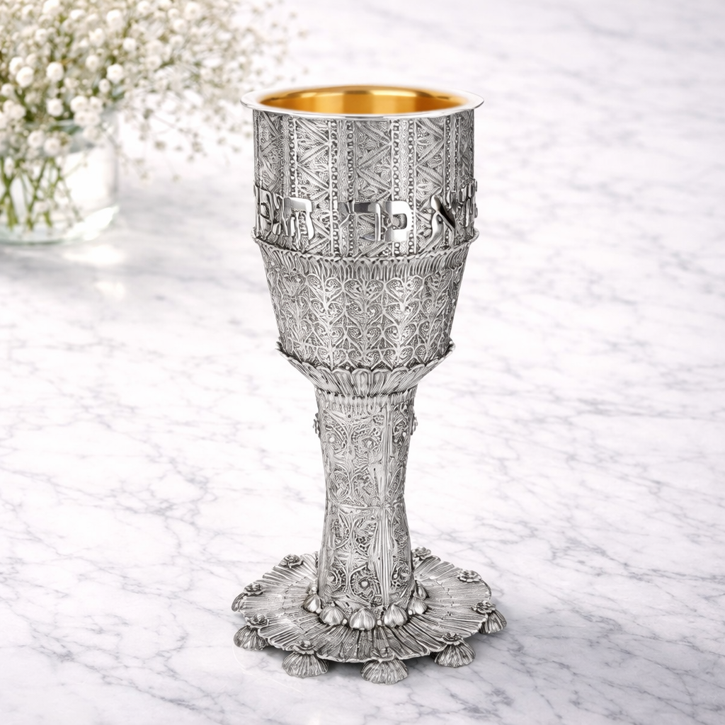 Ornate silver goblet with gold interior