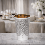 Ornate silver cup with design