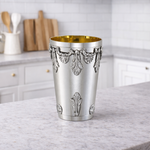 Silver plate with gold-lined cup.
