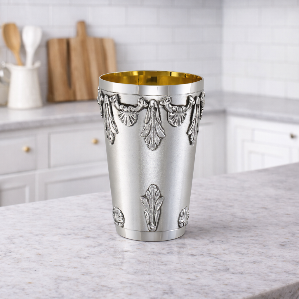 Silver plate with gold-lined cup.