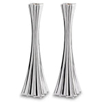 Two silver candle holders on white background