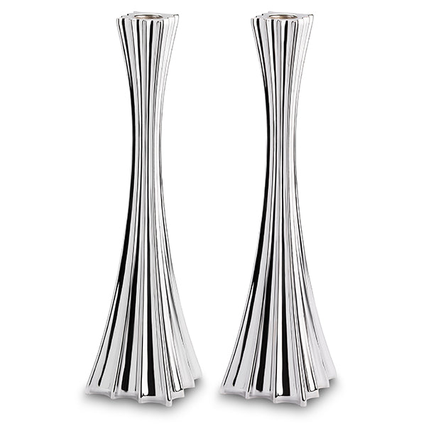 Two silver candle holders on white background